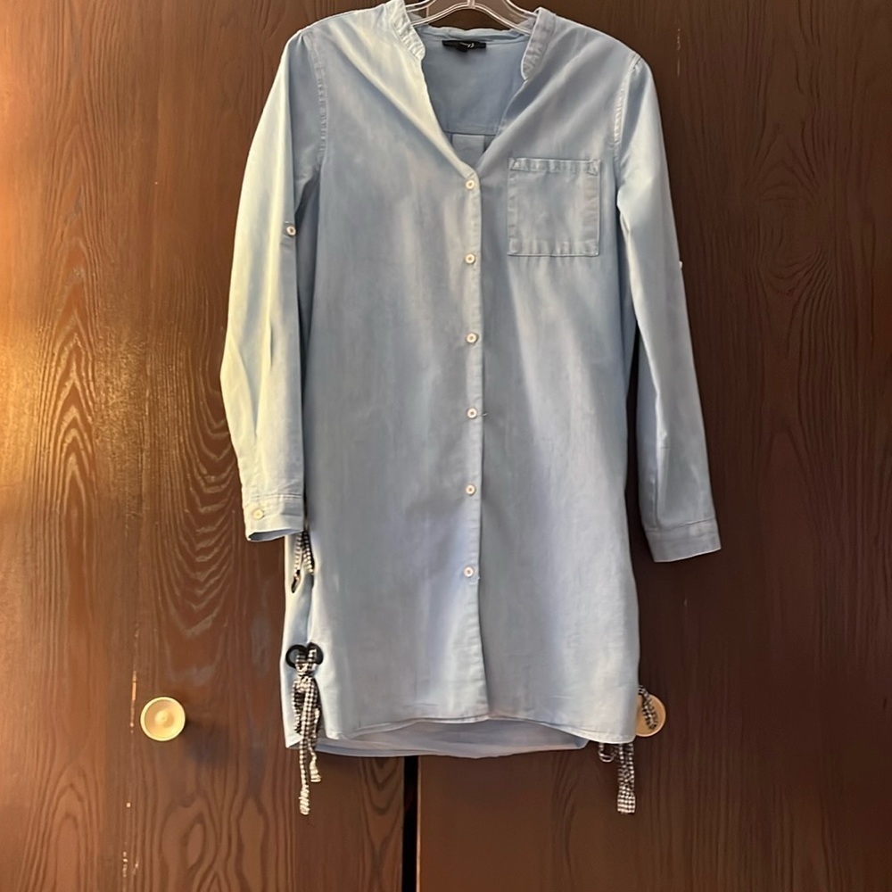 Very J long sleeved light blue, longer top with lacing on the sides. Size Small